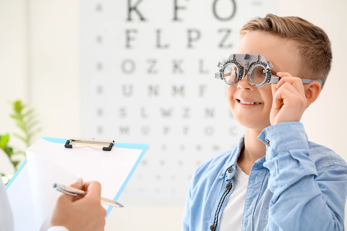 Child undergoing eye exam at optometry office
